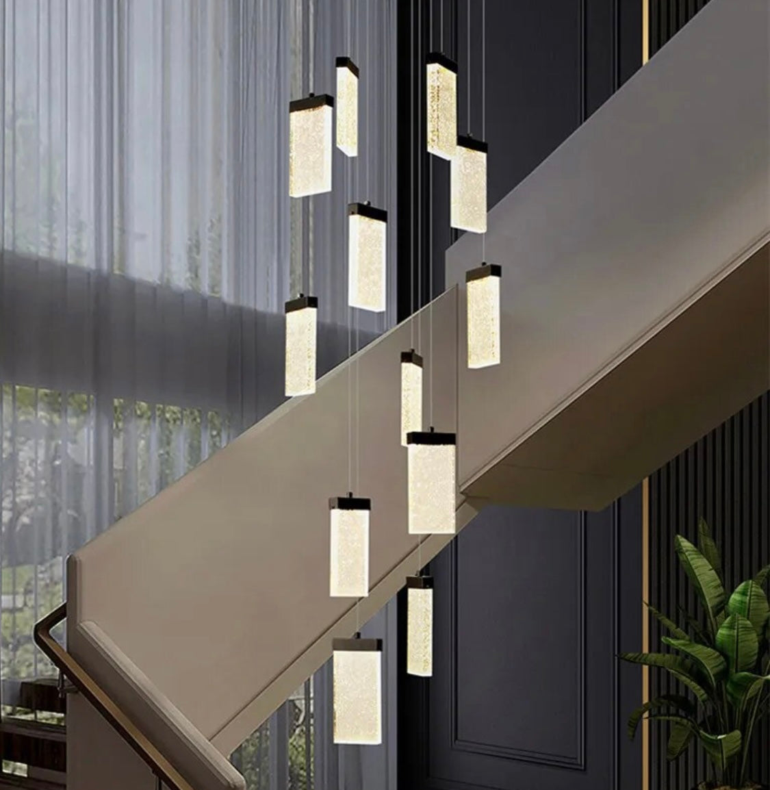 white and black hanging staircase chandelier