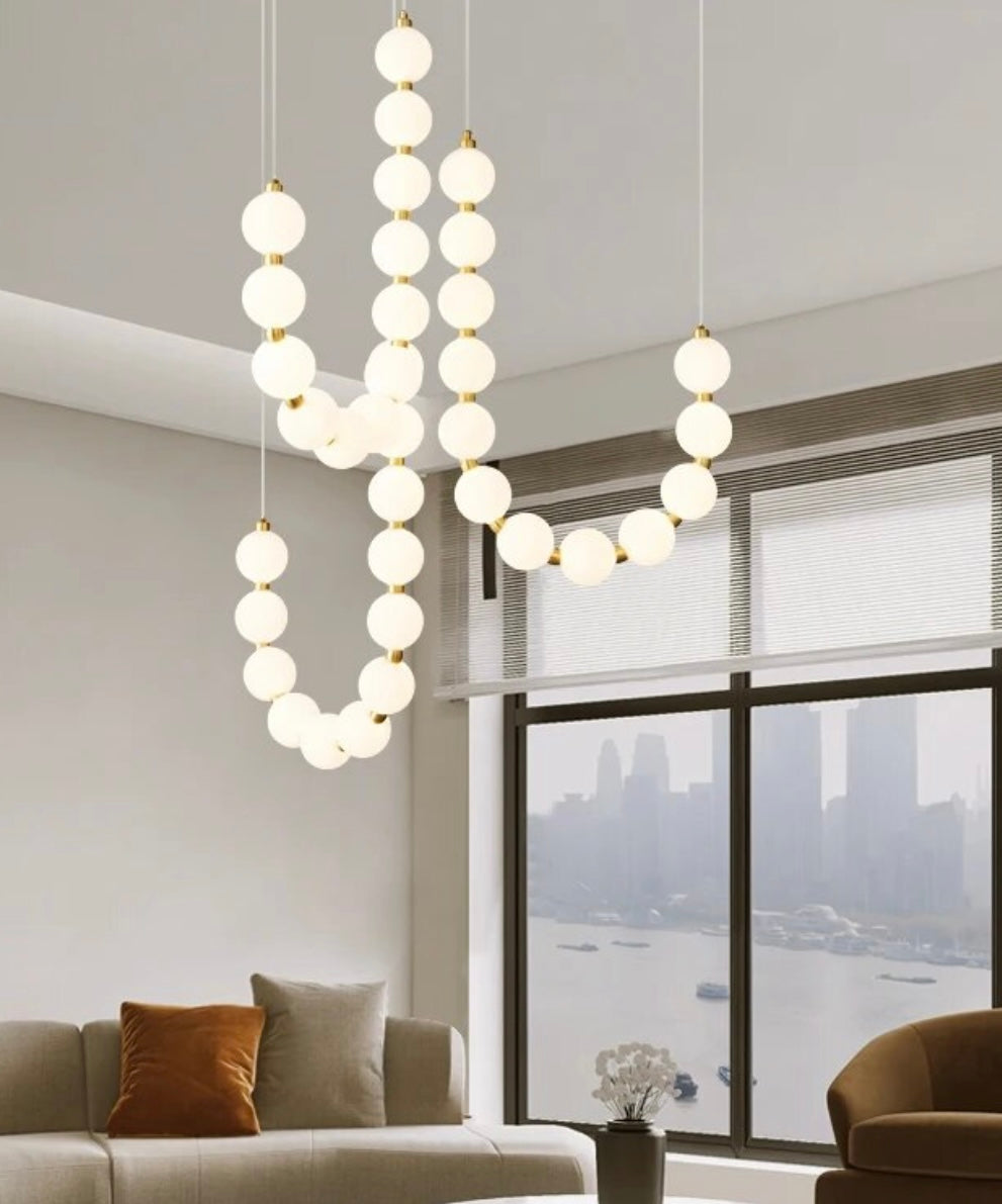 Sophisticated Nordic chandelier for staircases featuring frosted globes and modern design