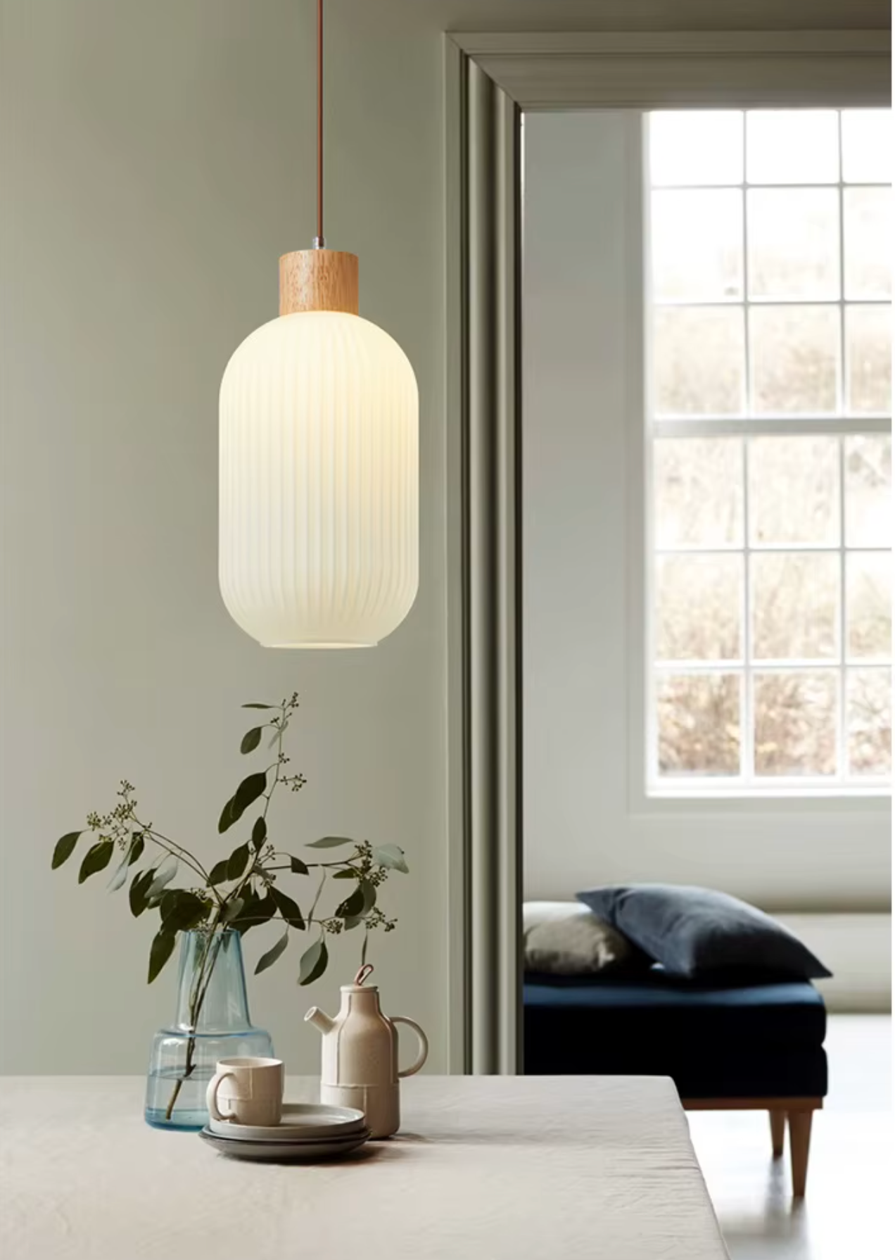 Long white glass pendant light with wood