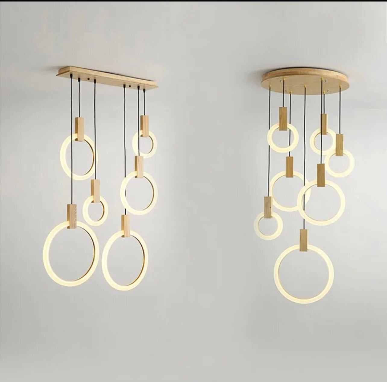 Adjustable ring light chandelier providing elegant lighting for a staircase