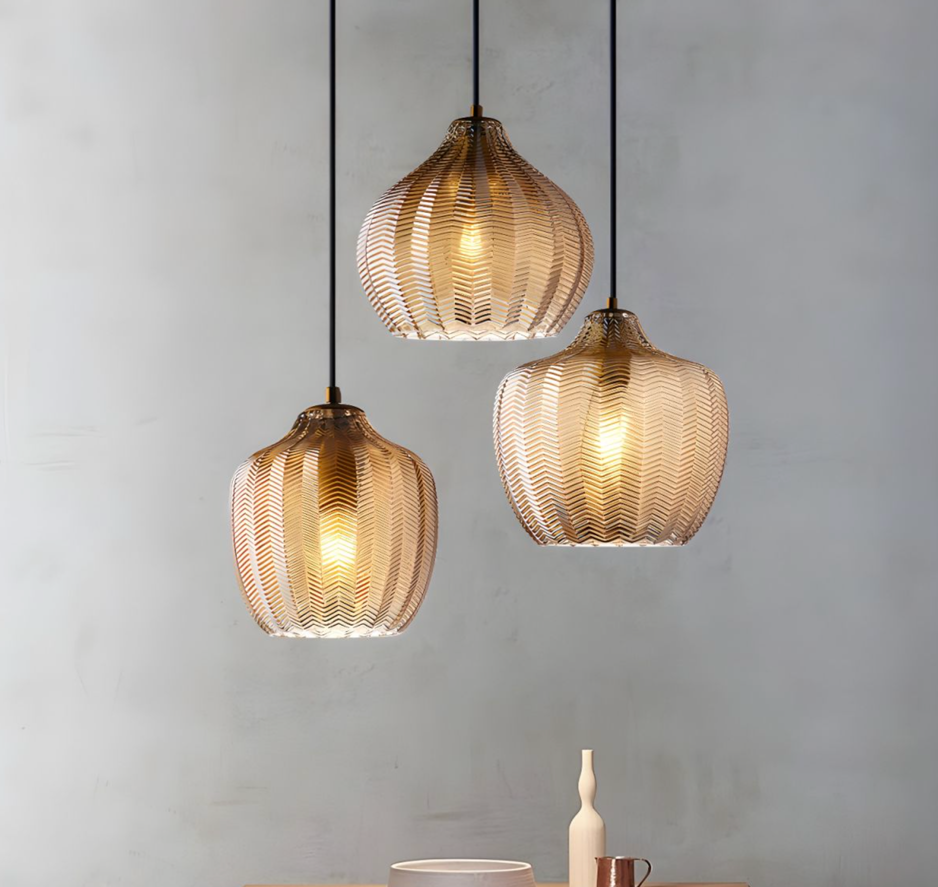 3 hanging amber glass pendant lights