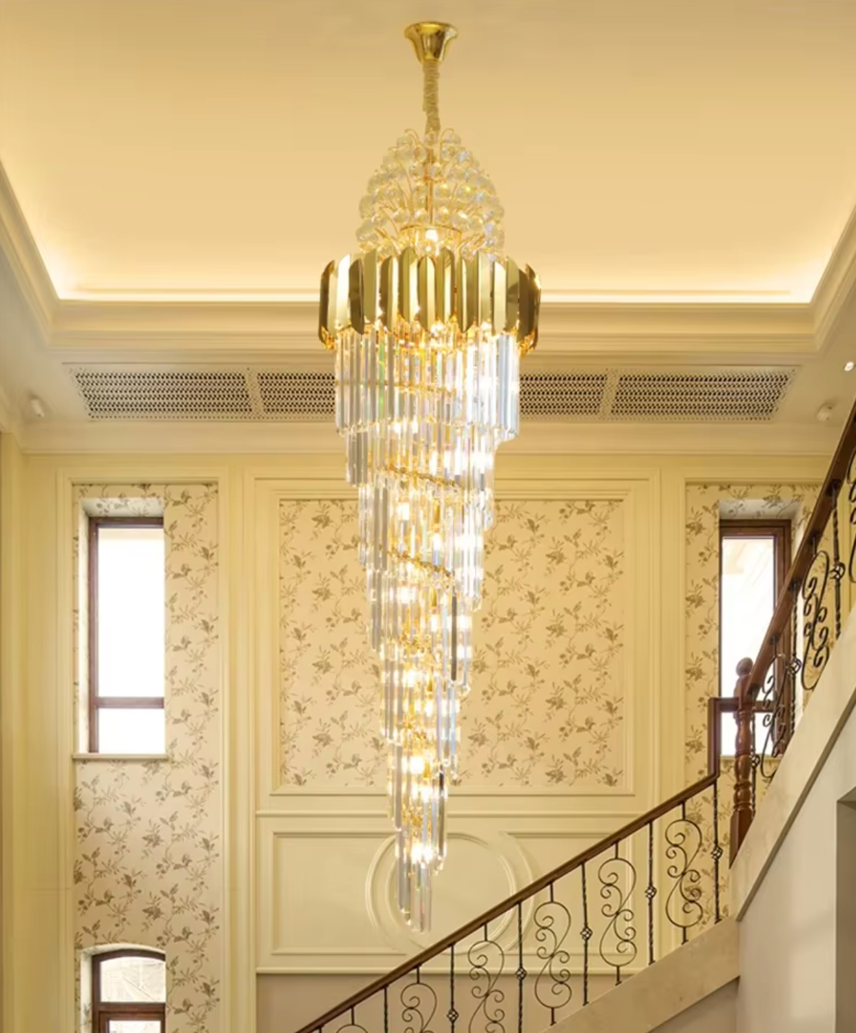 Cascading cone staircase chandelier featuring LED-compatible lighting