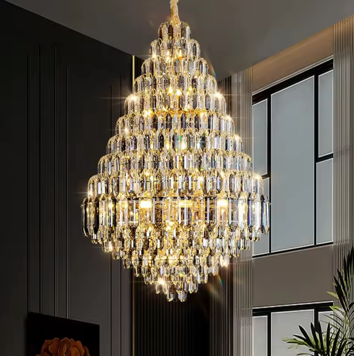 Crystal chandelier over staircase in hallway