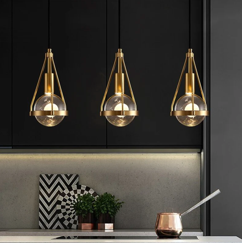 gold frame and clear globe pendant light with black cord