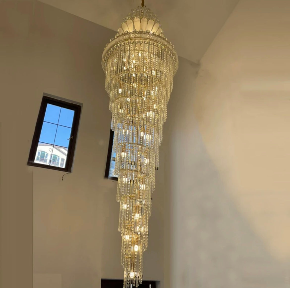 Gold crystal staircase chandelier with LED lights for energy-efficient illumination