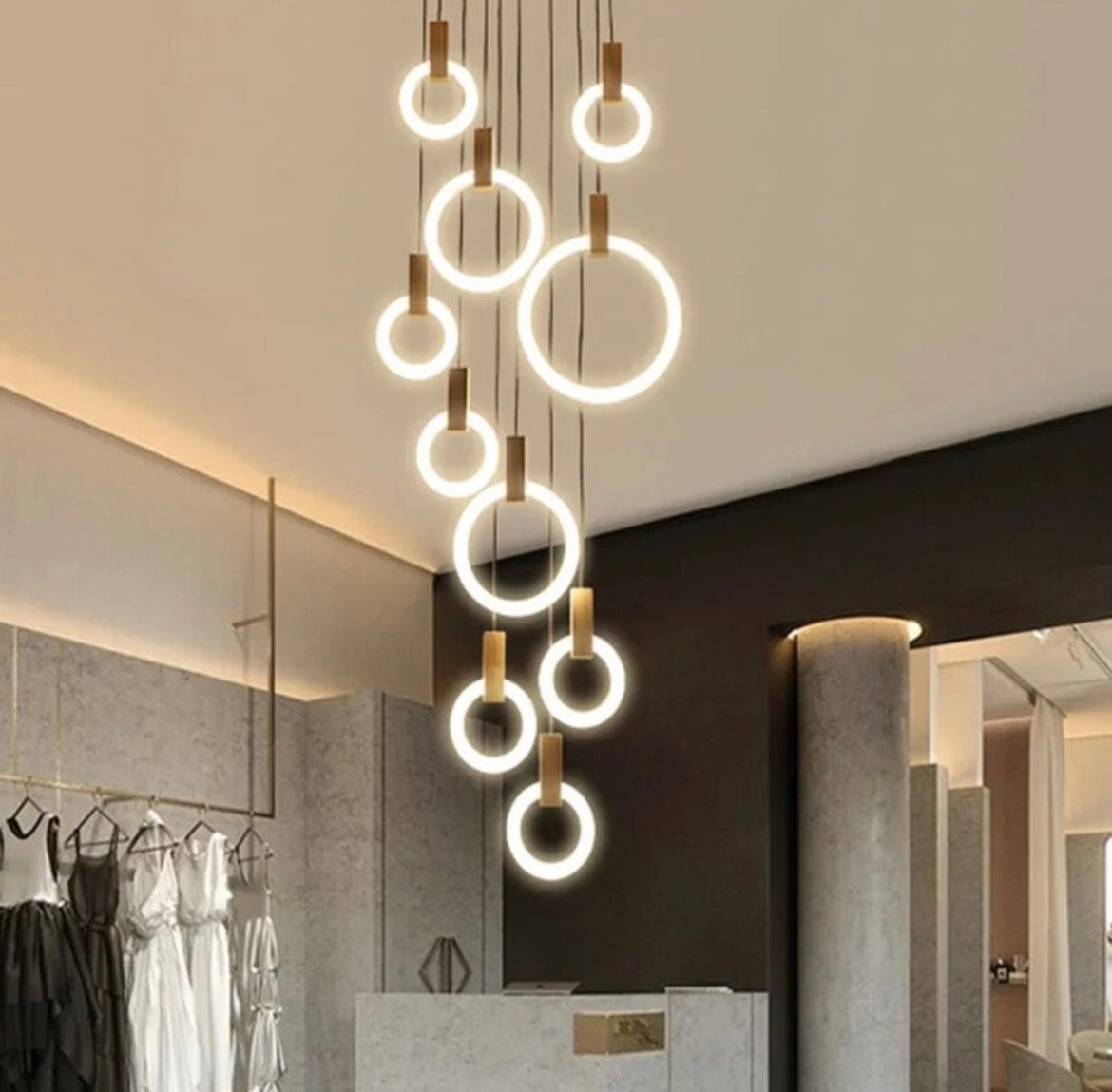 Hanging ring light chandelier with adjustable rings in a modern interior