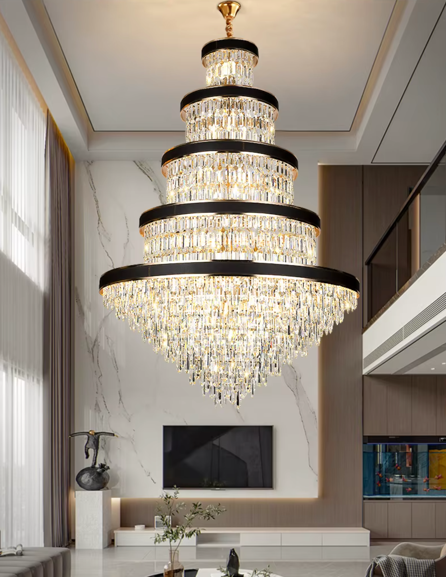 Modern black ring crystal chandelier illuminating a grand staircase