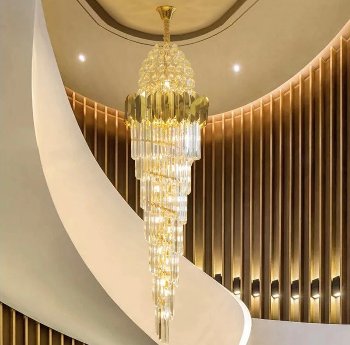 Modern cone-shaped chandelier providing stylish lighting for staircases