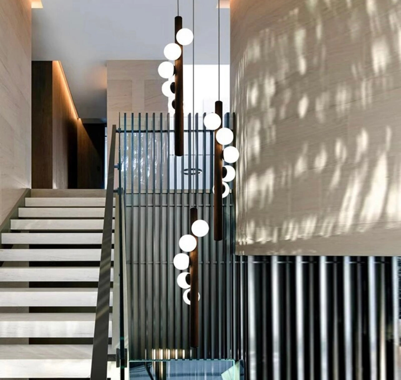 Spiral ball chandelier providing elegant lighting for a staircase