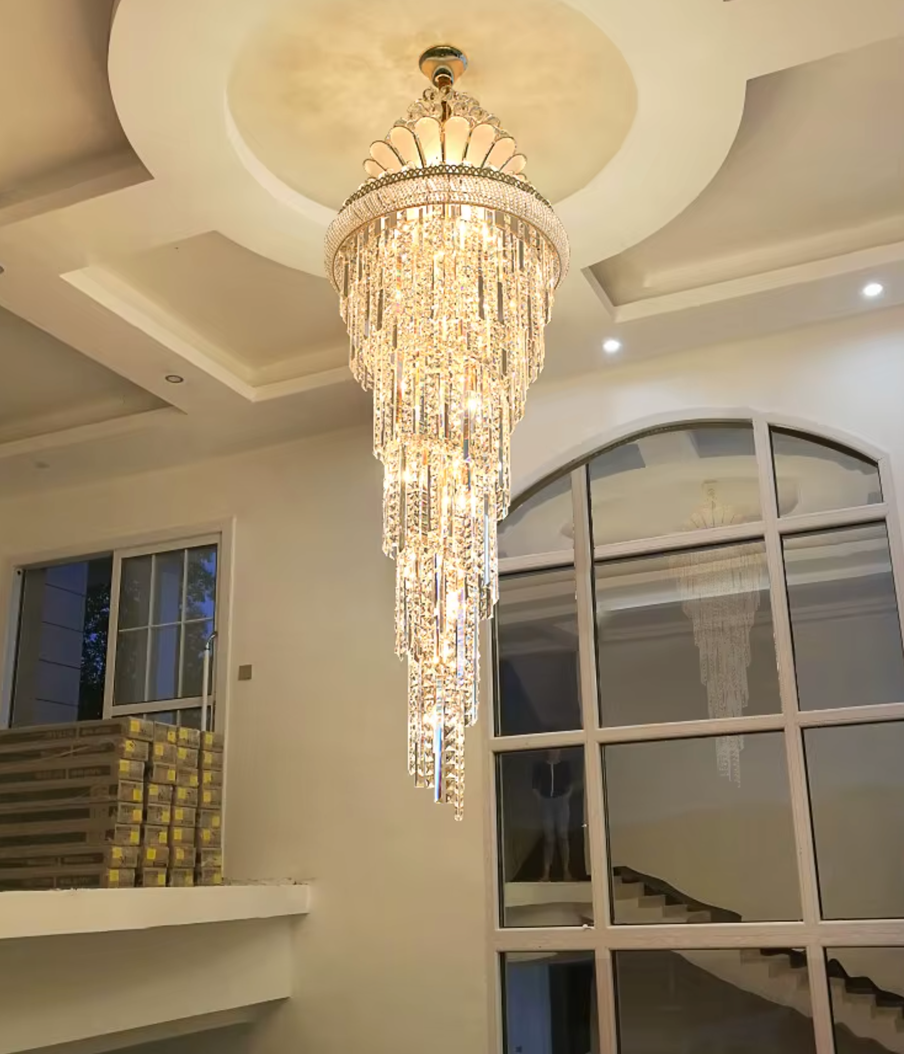 Swan-inspired crystal chandelier providing modern and luxurious lighting