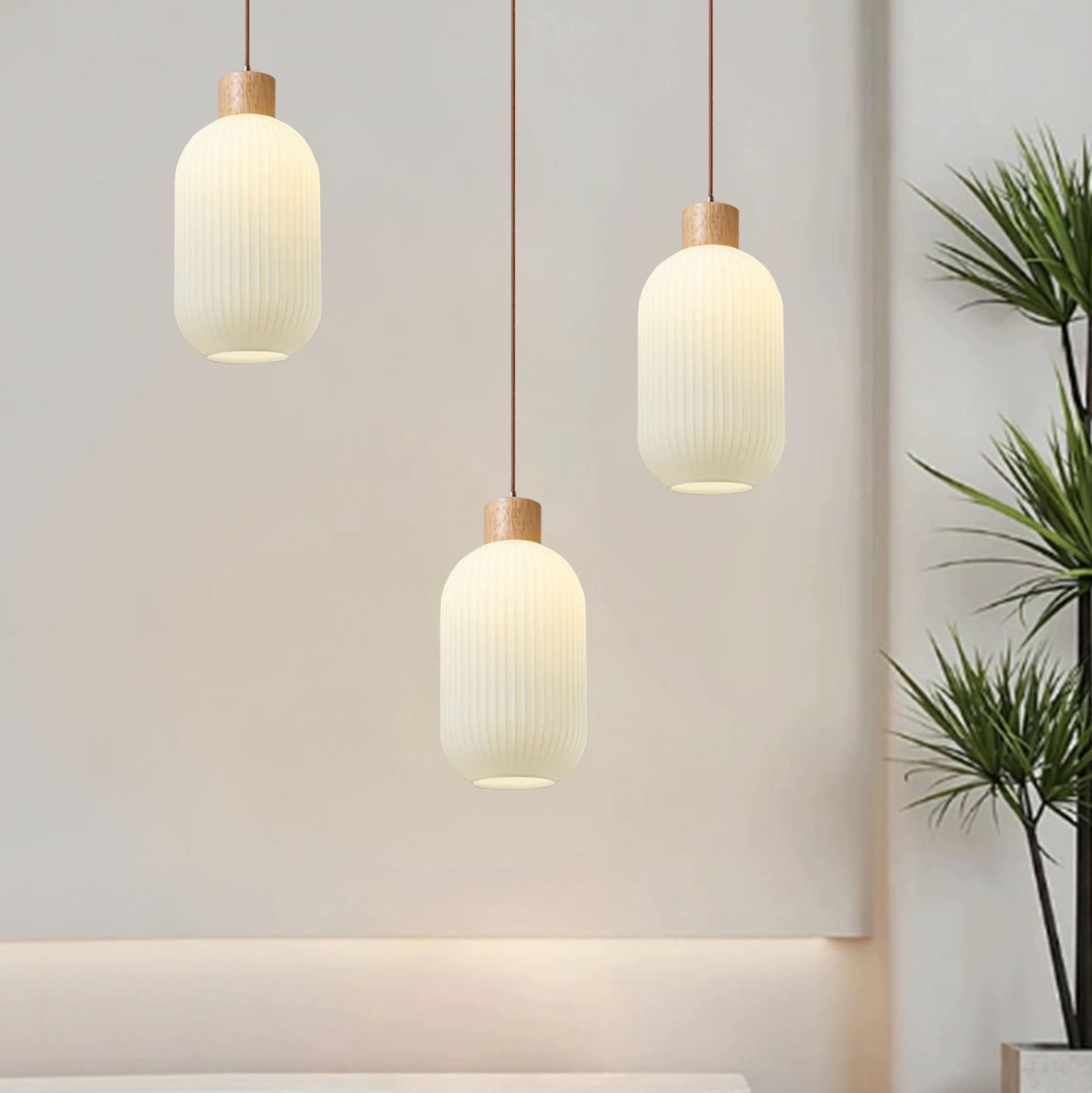 3 hanging white glass lights